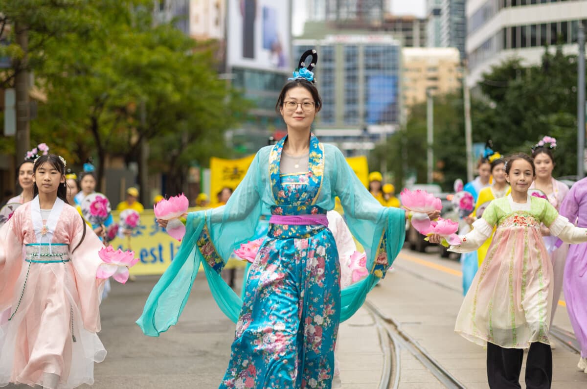 Falun Gong practitioners hold a parade in downtown Toronto to call for an end to the Chinese regime's persecution and transnational repression, on Sept. 19, 2026. (Alex Gurevich)
