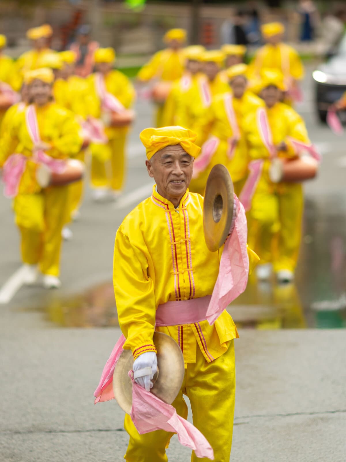 Falun Gong practitioners hold a parade in downtown Toronto to call for an end to the Chinese regime's persecution and transnational repression, on Sept. 19, 2026. (Alex Gurevich)