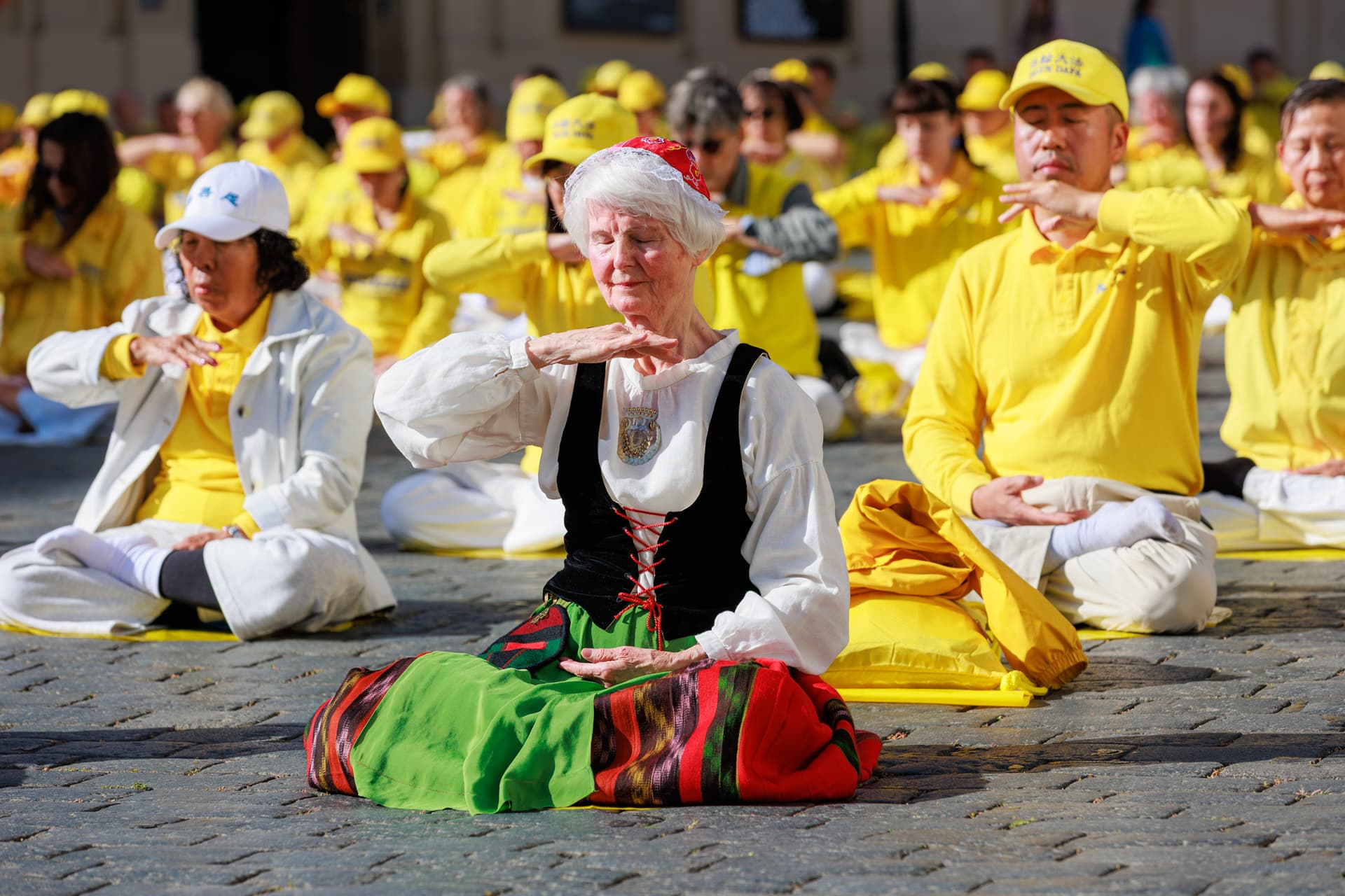 Falun Gong practitioners demonstrate the exercises before the parade in the Czech capital city of Prague on Sept. 19, 2026. (Zhang Qingqi/The Epoch Times)