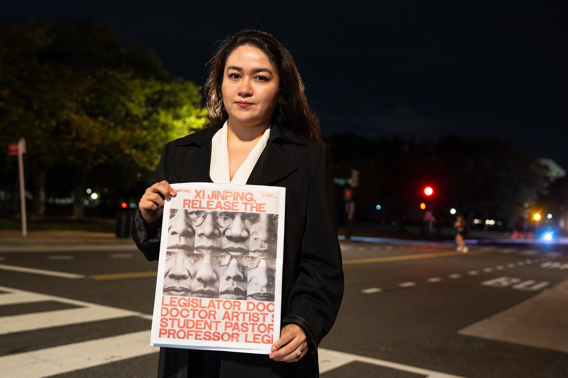 Jewher Ilham, whose father, Ilham Tohti, is currently serving a life sentence in China, participates in a Human Rights Foundation projection of photos of some political prisoners in China displayed on the National Gallery of Art, as Chinese leader Xi Jinping participates in a state visit to Washington on Sept. 23, 2026. (Samira Bouaou/The Epoch Times)