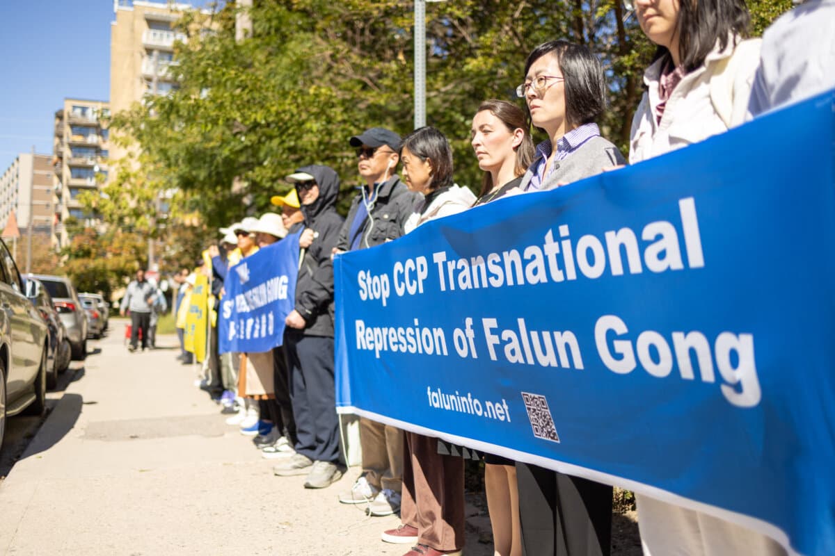 Falun Gong practitioners and supporters gather outside the Chinese Consulate in Toronto, after Falun Gong practitioners were attacked earlier in the week, on Sept. 24, 2026. (The Epoch Times)