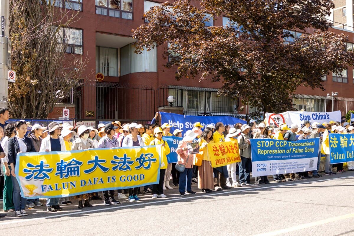 Falun Gong practitioners and supporters gather outside the Chinese Consulate in Toronto, after Falun Gong practitioners were attacked earlier in the week, on Sept. 24, 2026. (The Epoch Times)