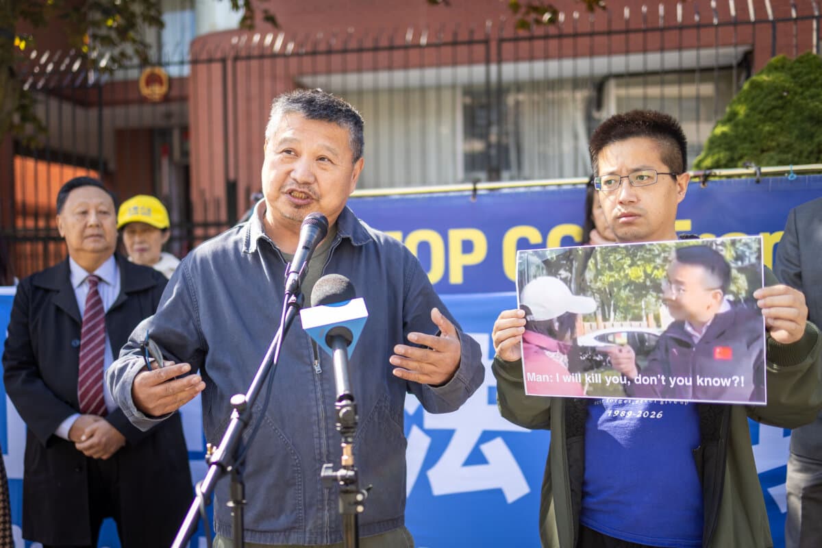 Houqiang Yu (L), president of the China Democratic Party of Canada, speaks at a press conference held outside the Chinese Consulate in Toronto in the aftermath of Falun Gong practitioners being attacked there earlier in the week, on Sept. 24, 2026. (The Epoch Times)