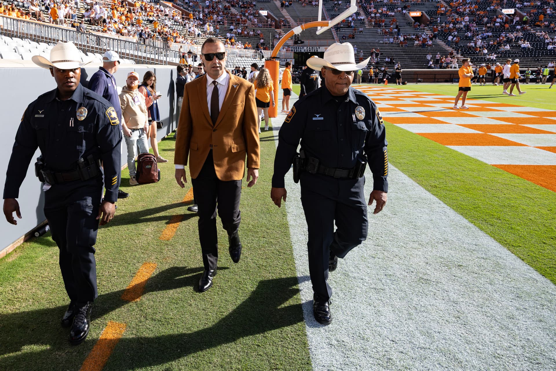 Texas head coach Steve Sarkisian is escorted into Neyland Stadium before an NCAA college football game between Tennessee and Texas in Knoxville, Tenn., on Sept. 26, 2026. (Wade Payne/AP Photo)