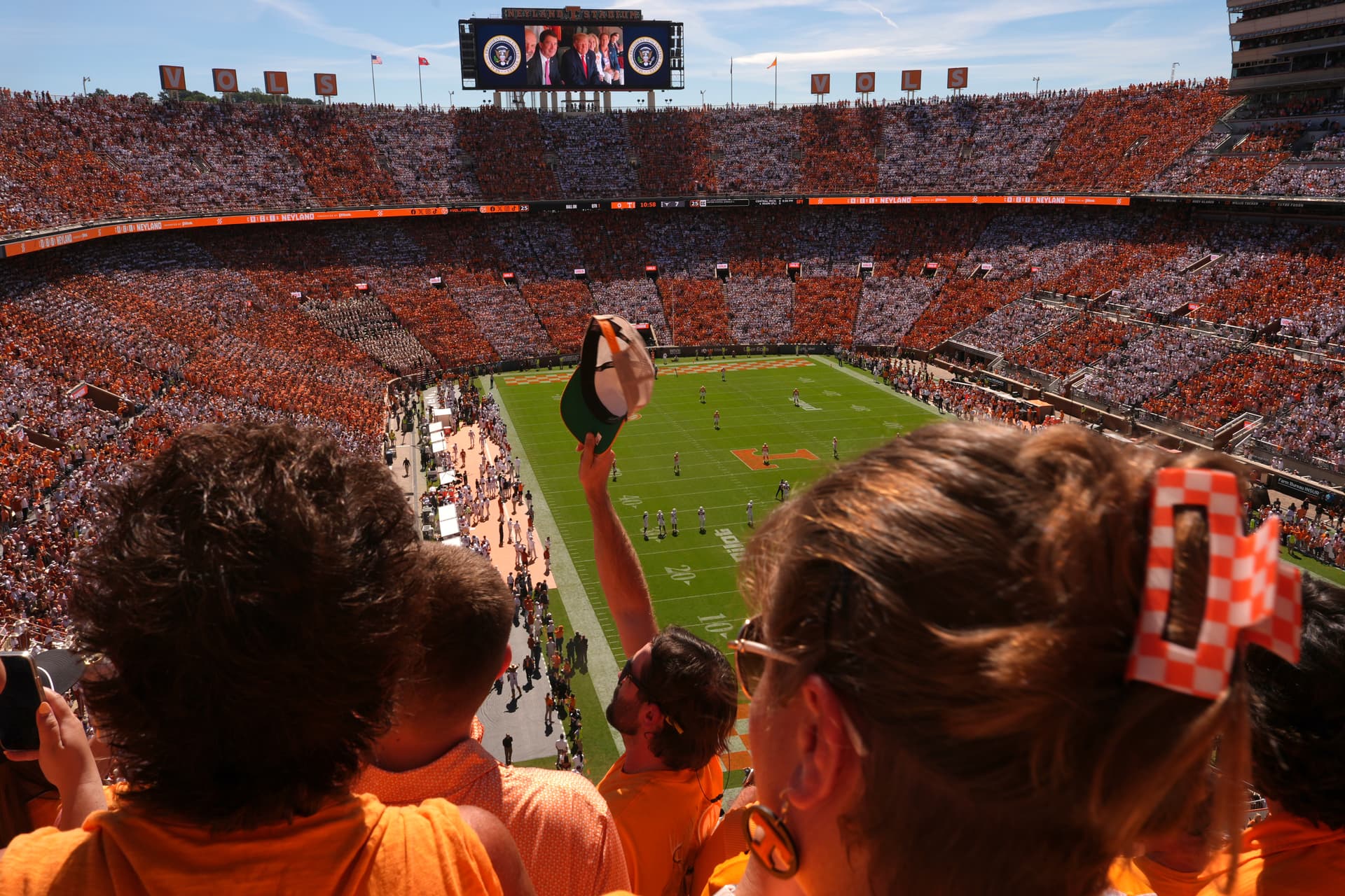 Attendees cheer as President Donald Trump is pictured on screen during an NCAA college football game between Tennessee and Texas at Neyland Stadium in Knoxville, Tenn., on Sept. 26, 2026. (Julia Demaree Nikhinson/AP Photo)
