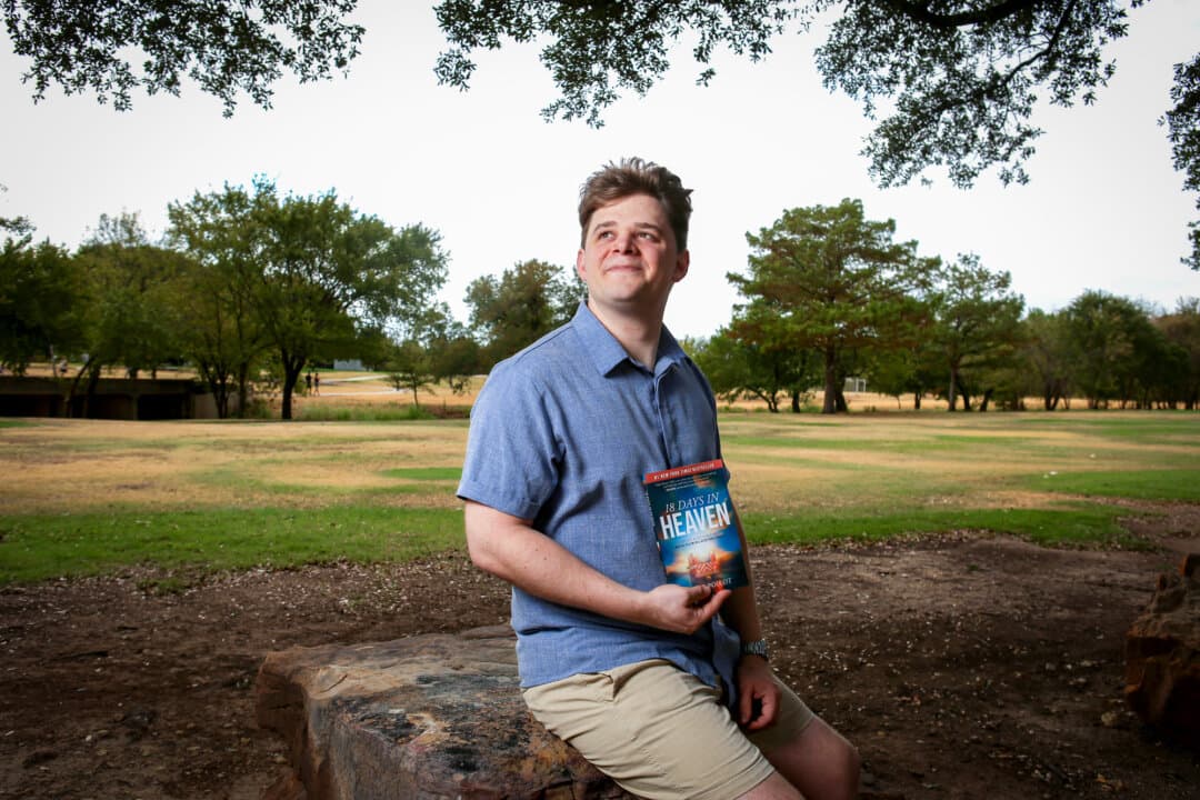Gabe Poirot holds a copy of the book detailing his near death experience and spiritual conversion, in Fort Worth, Texas, on Sept. 20, 2026. The experience “set a fire in my heart,” Poirot says. (Bobby Sanchez for The Epoch Times)