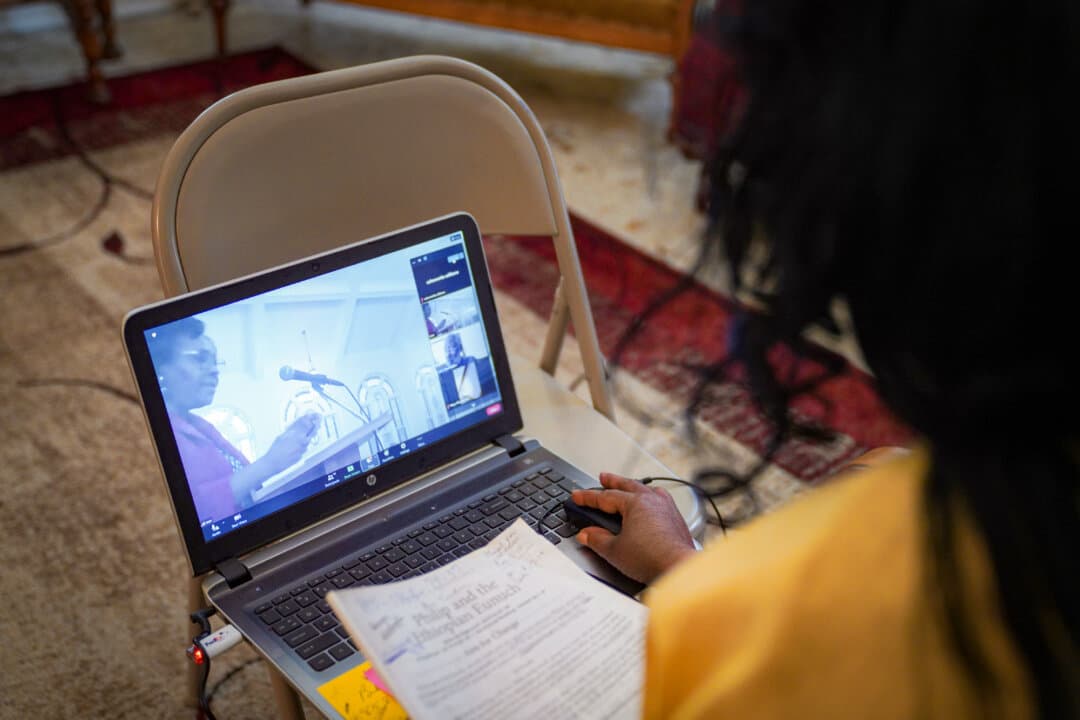 Calvernetta Williams, a long-time congregant of Zion Baptist Church, attends a virtual Sunday school class from her home in Columbia, S.C., on April 16, 2023. Today's churches and religious influencers are harnessing technology to reach worshipers with spiritual content. (Jessie Wardarski/AP Photo) 