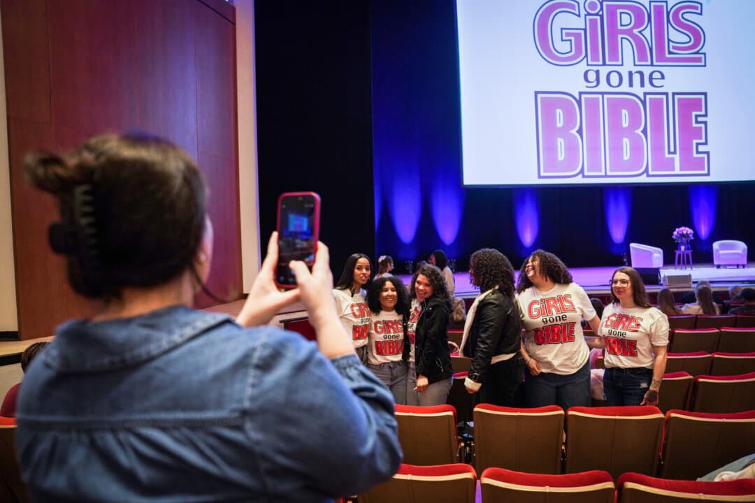 Followers of the Christian podcast “Girls Gone Bible” take a group photo before the group's live show at Atlanta Symphony Hall in Atlanta on Nov. 14, 2025. (Jessie Wardarski/AP Photo)