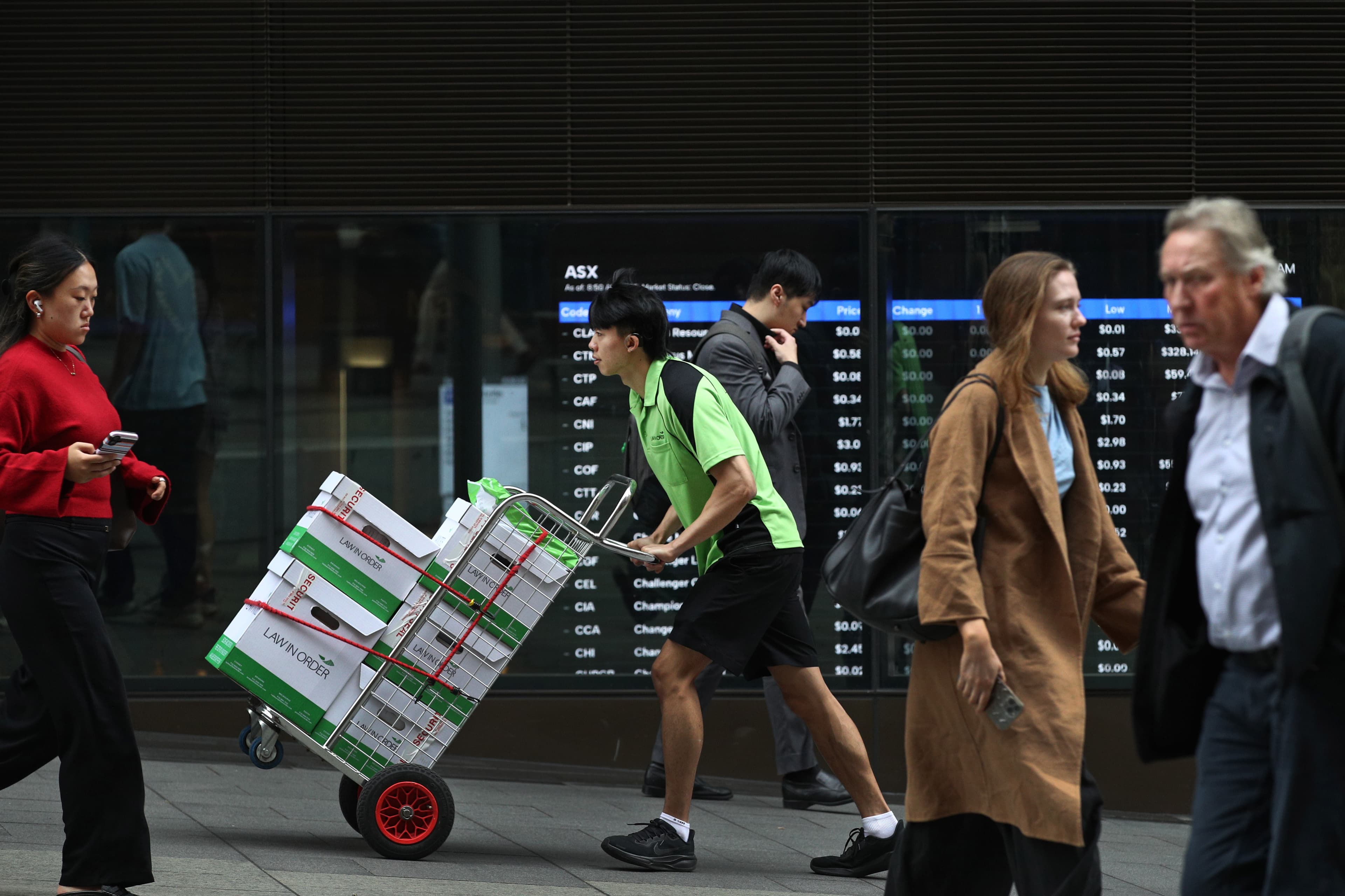 Pedestrians move past the Australian Securities Exchange (ASX) headquarters in Sydney, Australia, on May 4, 2026. (Lisa Maree Williams/Getty Images)
