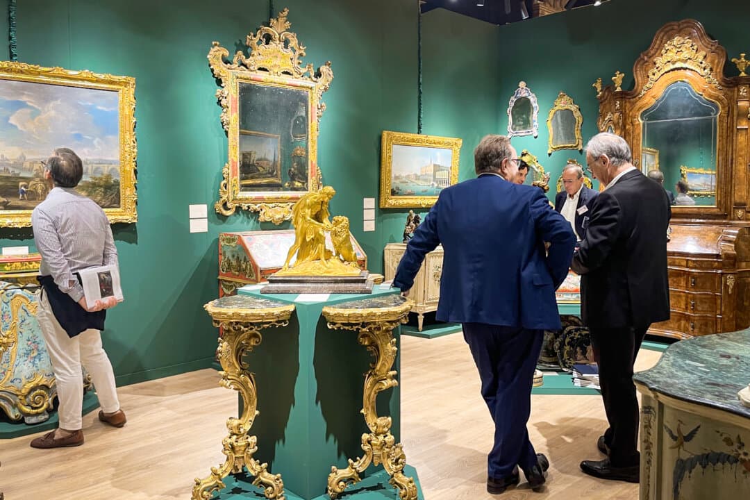 Works on display by Attilio Cecchetto Antiquario at the 34th Biennale Internazionale dell’Antiquariato include a Louis XV walnut burl trumeau from the first half of the 18th century, in Florence, Italy, on Sept. 26, 2026. (Beige Luciano-Adams/The Epoch Times)
