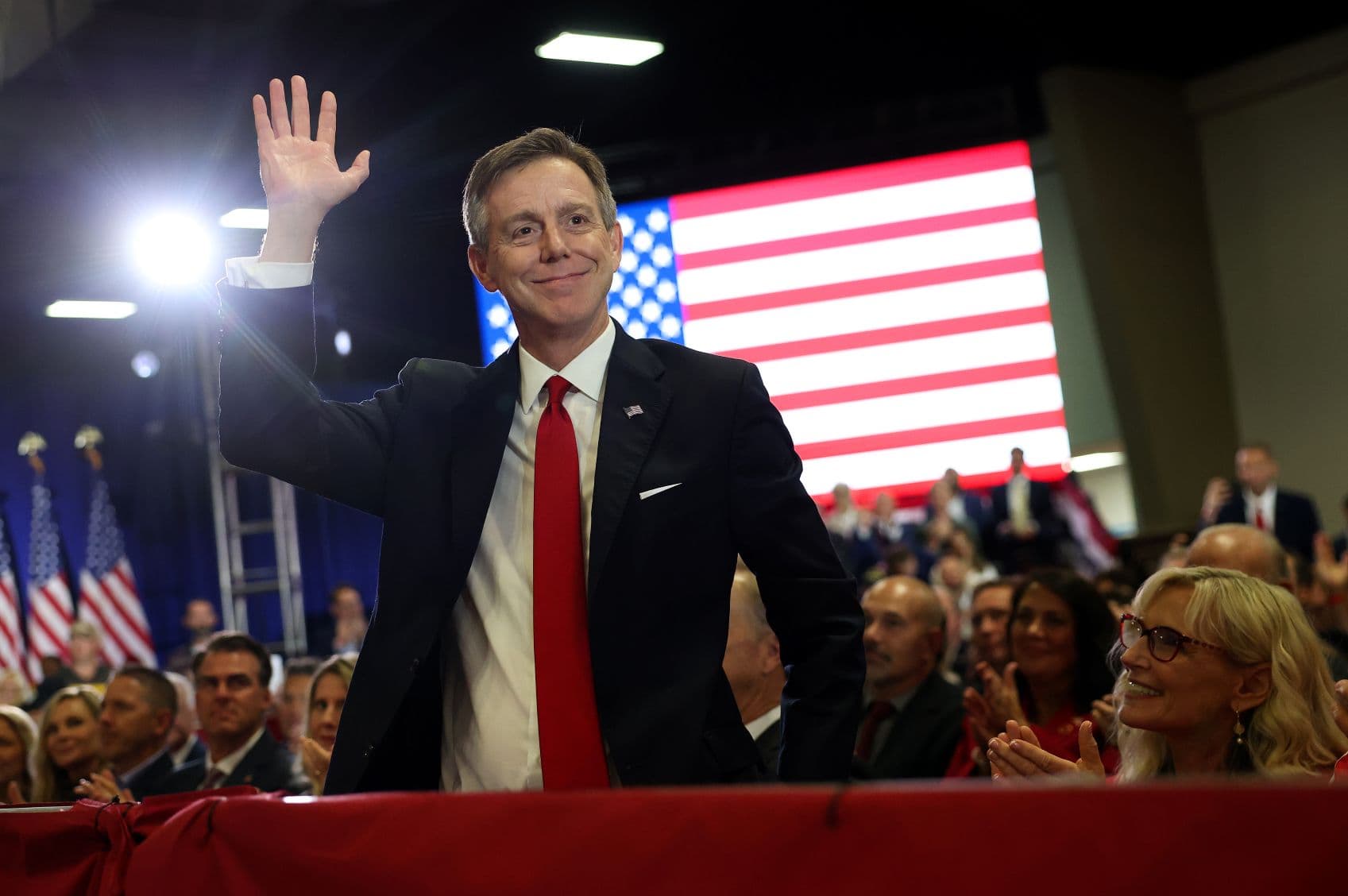 Republican nominee for governor of Oklahoma Mike Mazzei waves as U.S. President Donald Trump acknowledges him during a campaign rally in Durant, Okla., on Oct. 1, 2026.  (Kevin Dietsch/Getty Images)