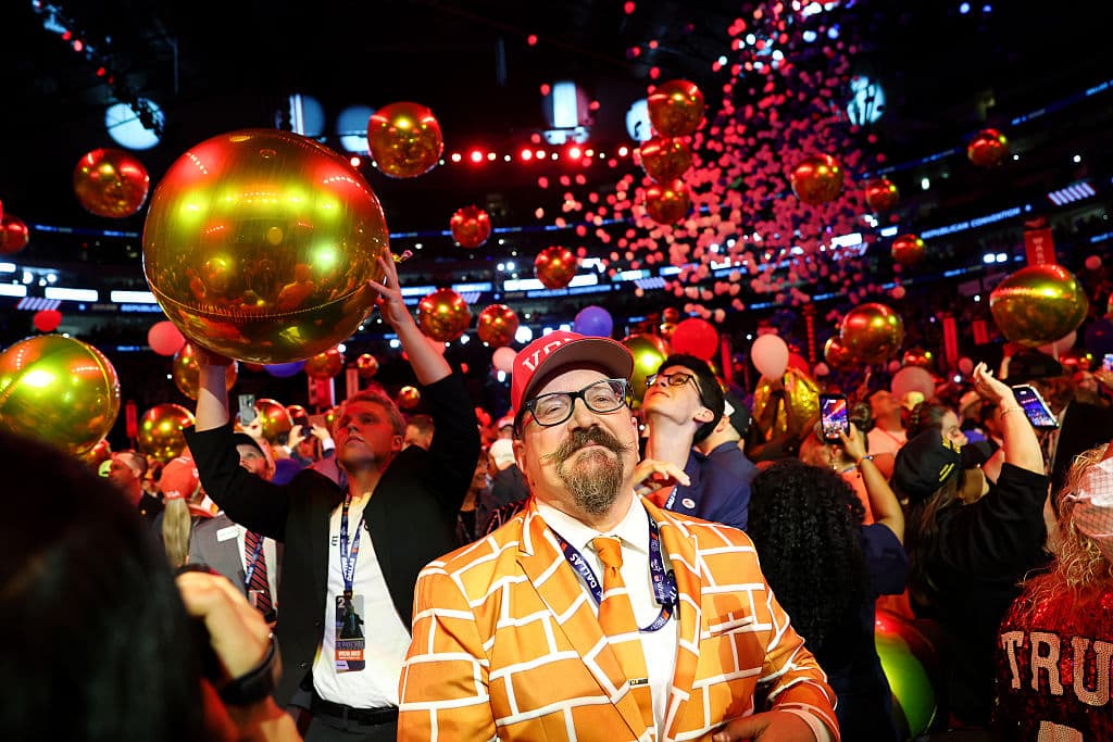 Balloons fall around Blake Marnell, wearing a suit jacket with bricks representing a border wall, at the conclusion of the second day of the 2026 Republican National Convention at the American Airlines Center in Dallas, Texas, on Sept. 10, 2026. (Kevin Dietsch/Getty Images)