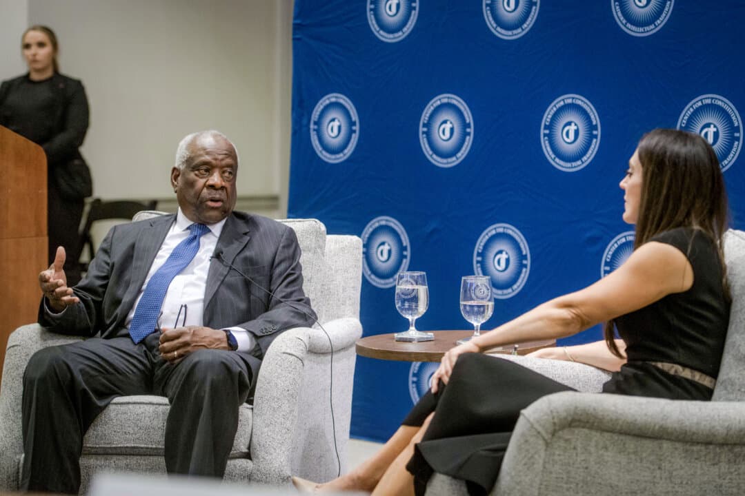(L–R) Supreme Court Associate Justice Clarence Thomas joins Professor Jennifer Mascott at The Catholic University of America's Columbus School of Law for a conversation in Washington on Sept. 25, 2025. (Rod Lamkey Jr./AP Photo)