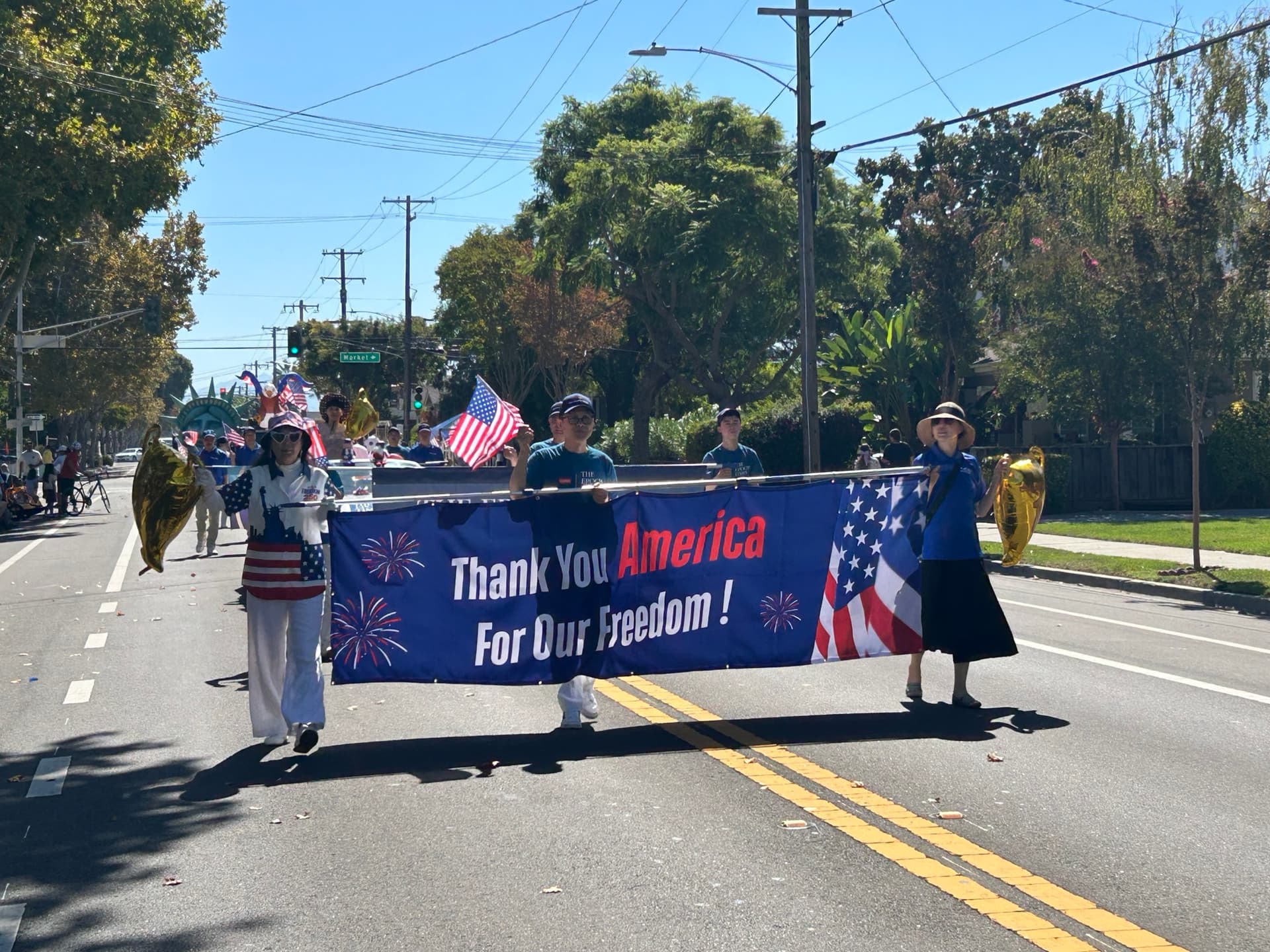The Northern California Epoch Times contingent marches in the Santa Clara Parade of Champions on Oct. 3, 2026. (Nathan Su/The Epoch Times)