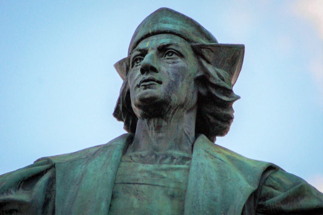 (Left) A statue of Christopher Columbus looks out over the city of Syracuse, N.Y., in this undated photo. (Right) An inscription at the base of the city's Columbus statue notes the contribution of Italian Americans. (Courtesy of Anthony Ilacqua)
