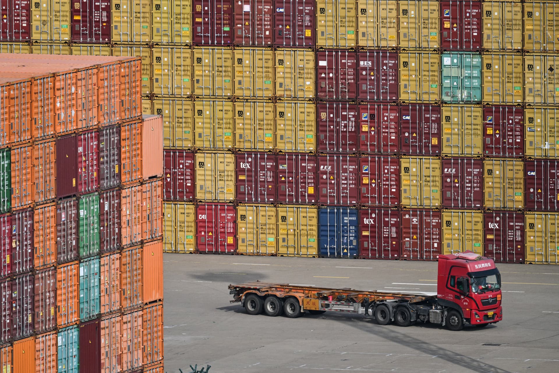 A truck drives past containers at the Port of Ningbo-Zhoushan in Ningbo, in China's eastern Zhejiang Province on Sept. 22, 2026. (Hector Retamal/AFP via Getty Images)