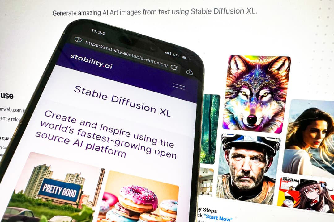 The desktop and mobile websites for image-generator Stable Diffusion are shown in New York on Oct. 24, 2023. (John Minchillo/AP Photo/File)