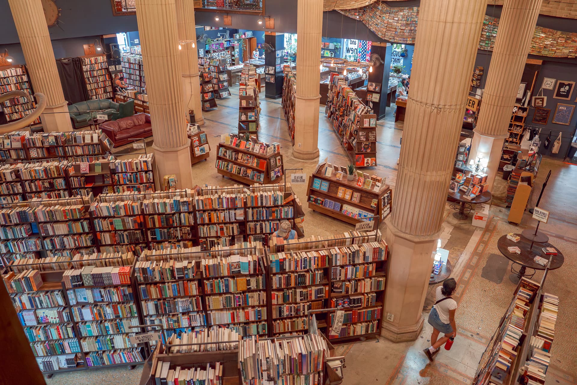 The Last Bookstore in Los Angeles features maze-like bookshelves, tall ornate columns, and warm lighting, creating a unique and inviting atmosphere. (Alexkane1977vi/Dreamstime/TNS)