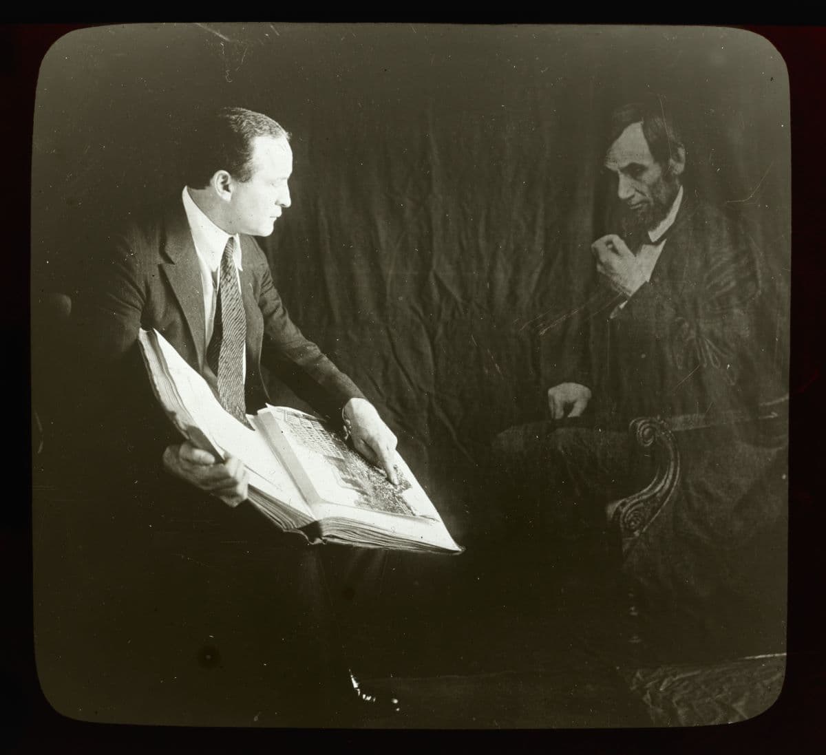 Houdini and the "ghost" of Abraham Lincoln. Houdini demonstrates how a photographer could produce fraudulent "spirit photographs" that purported to document the apparition and social interaction of the dead. Library of Congress. (Public Domain)