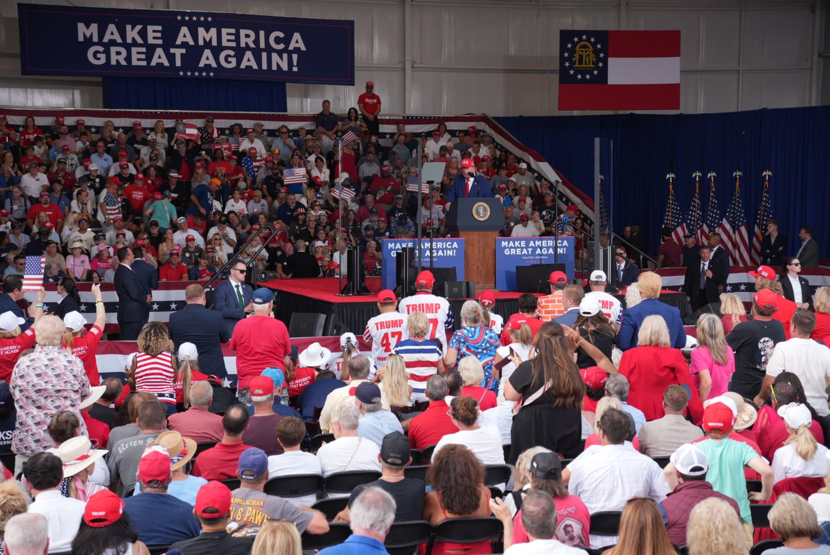 Supporters listen to President Donald Trump give a speech with midterm elections underway across the country. Trump went to boost voters in Dalton, Ga., on Oct. 16, 2026. (Troy Myers/The Epoch Times)