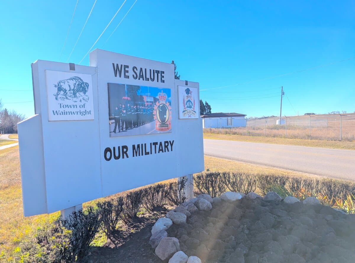 A sign honouring military members stands near the entrance to CFB Wainwright near Wainwright, Alta., on Oct. 18, 2026. (Paul Rowan Brian/The Epoch Times)