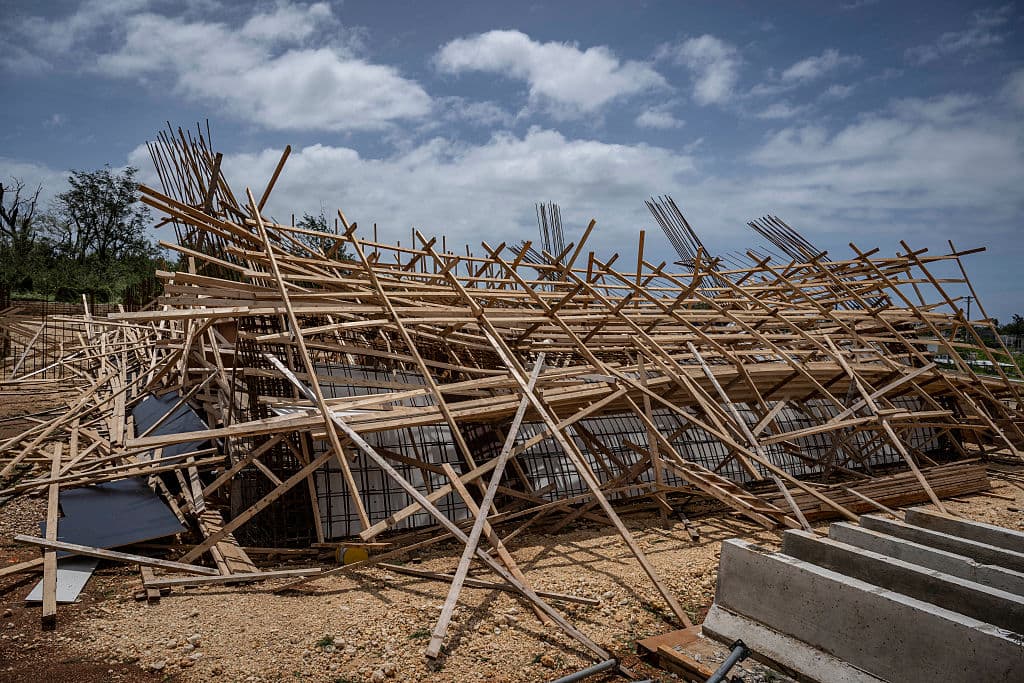 A building under construction lies collapsed after strong winds and heavy rain from Super Typhoon Bavi in Guam on July 7, 2026. (Yuichi Yanazaki/AFP via Getty Images)