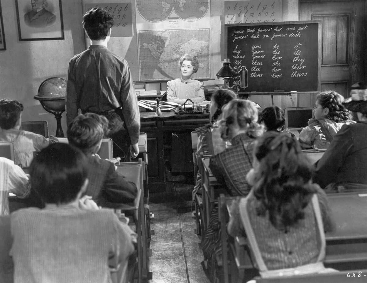 Miss Moffat (Bette Davis) sets up a school, in "The Corn Is Green." (Warner Bros.)