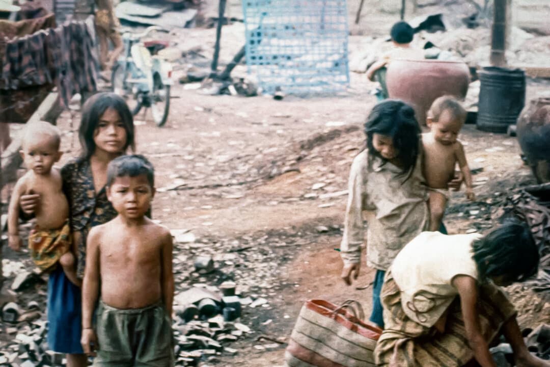 (Left) Cambodian children scavenge amid the ruins left by an insurgent Khmer Rouge attack on a shanty town on the edge of Phnom Penh, Cambodia, in February 1974. Hunger would continue to be a way of life for these children: Famine would claim the lives of up to 1.5 million people in Cambodia after the Khmer Rouge seized control. (Center) Russian children display the ravages of malnutrition in west-central Russia, in 1921. The Russian famine of 1921–1922 killed an estimated 5 million people. A decade later, the Soviet famine of 1932–1933 would result in the deaths of up to 10.8 million people. (Right) Chinese refugees wait for a meal in Hong Kong in May 1962. During the famine caused by Mao Zedong's "Great Leap Forward," up to 200,000 starving Chinese fled to British-ruled Hong Kong. (Carl D. Robinson/AP Photo/File, Public Domain, AFP Photo via Getty Images)