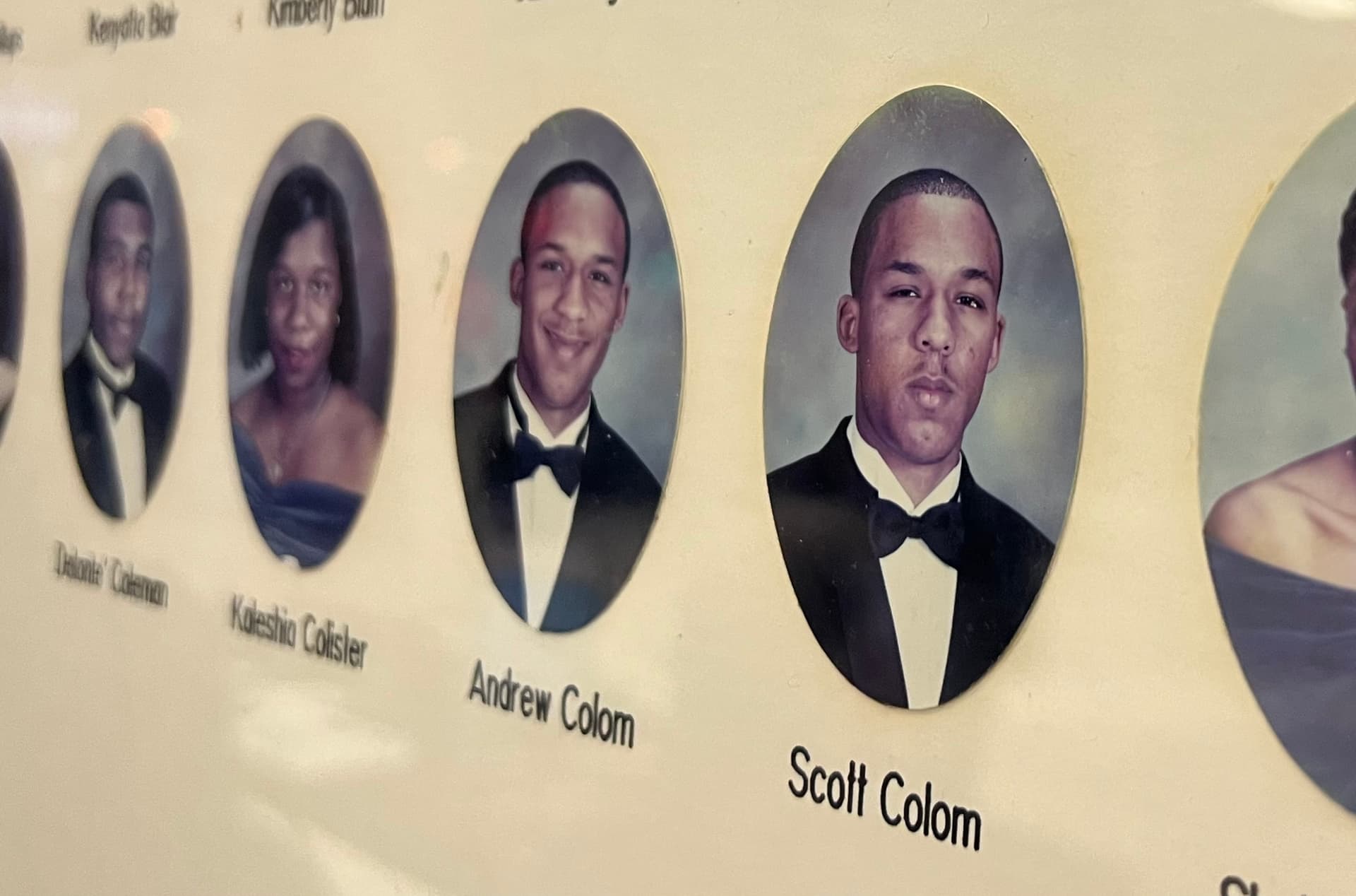 A senior photo of a young Scott Colom, a Mississippi U.S. Senate candidate, is framed in a class of 2001 display on the wall inside Columbus High School on Oct. 22, 2026. (Jacki Thrapp/The Epoch Times).