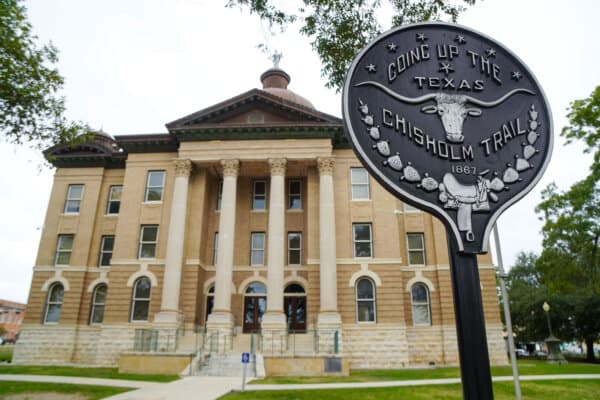 A monument to the Chisholm Trail cattle-driving route outside the Hays County Historic Courthouse in San Marcos, Texas, on Oct. 16, 2026. (Nathan Worcester/The Epoch Times)