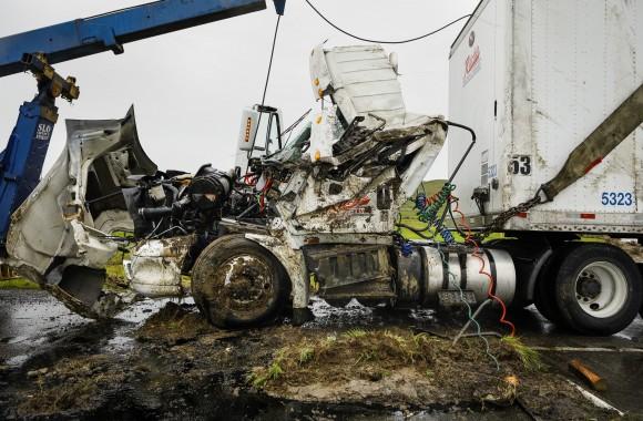 A crew from Johnboy's Towing uprights a big rig that was overturned by high winds at the Highway 46 and 41 interchange in Cholame, Calif., Friday, Feb. 17, 2017. (Joe Johnston/The Tribune (of San Luis Obispo)