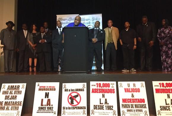 Rudolph "Rock Head" Johnson, chief of staff of the Amer-I-Can Foundation, speaks with graduates of the foundation's program at the eighth annual banquet fundraiser for Silver Lining of Hope Crusade in Carson, Calif. on Apr. 7. (Sarah Le/Epoch Times)