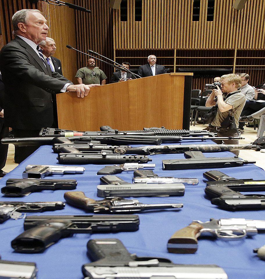 Michael Bloomberg at a press conference after a gun smuggling arrest of 19 people in New York on Aug. 19, 2013. (Mark Lennihan/AP)