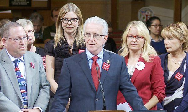 City council members Paul Koretz (L) and Paul Krekorian (R), along with and members of Women Against Gun Violence (back row), speak about the need for stricter gun laws in front of the Los Angeles City Council Meeting in Los Angeles, Calif. on Nov. 7, 2014. (Eric Zhang/The Epoch Times)