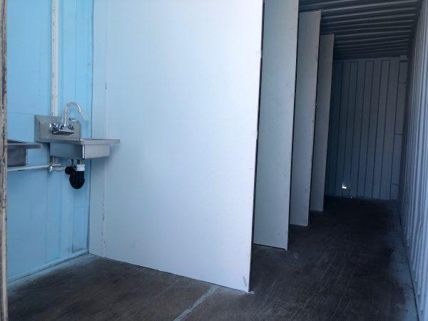 The inside of a shipping container with showers in Garden Grove, Calif. on Sept. 16, 2018. (Annie Wang/Epoch Times)