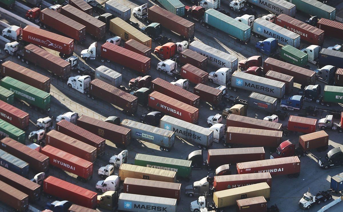 Trucks prepare to haul shipping containers at the Port of Los Angeles in San Pedro, Calif., on Sept. 18, 2018. (Mario Tama/Getty Images)
