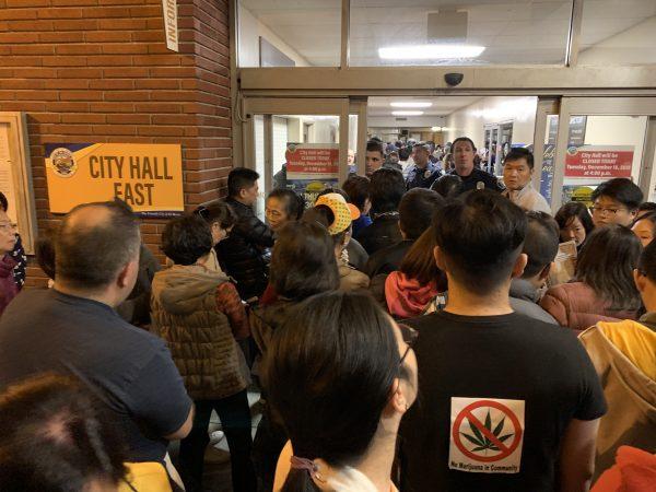 Opponents of the cannabis project waited at the door of El Monte City Hall in El Monte, California on Dec. 19, 2018. (Jenny Liu/The Epoch Times)