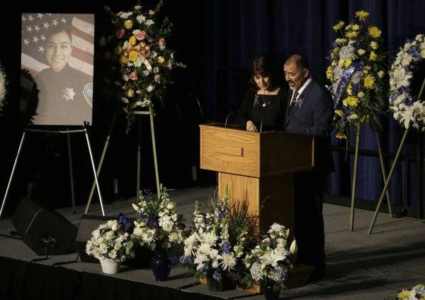 Lupe Corona, left, listens as Merced Corona speaks during funeral services for their daughter, Davis Police Officer Natalie Corona, at the University of California, Davis, in Davis, Calif., on Jan. 18, 2019. (Rich Pedroncelli, pool/AP)