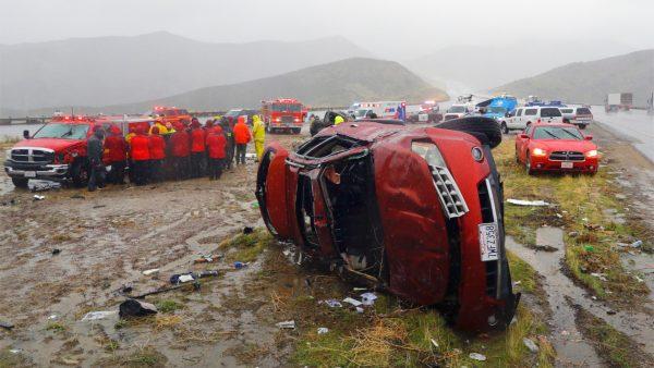 An overturned vehicle is seen at a scene of a fatal accident, where a volunteer member of the Ventura County search and rescue team was killed, along Interstate Highway 5 south of Pyramid Lake, Calif., on Feb. 2, 2019. (Marcio Jose Sanchez/AP)