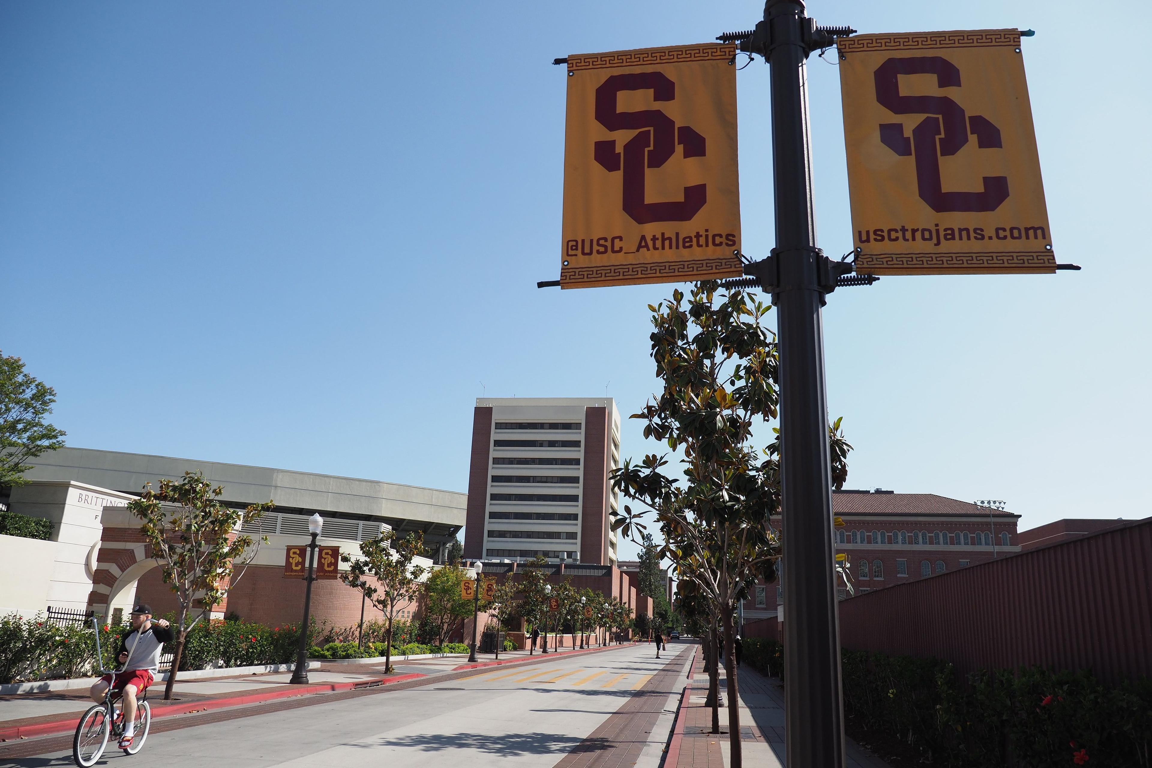 A young man rides a bicycle on the campus of the University of Southern California (USC) in Los Angeles on May 17, 2018. (Robyn Beck/AFP via Getty Images)