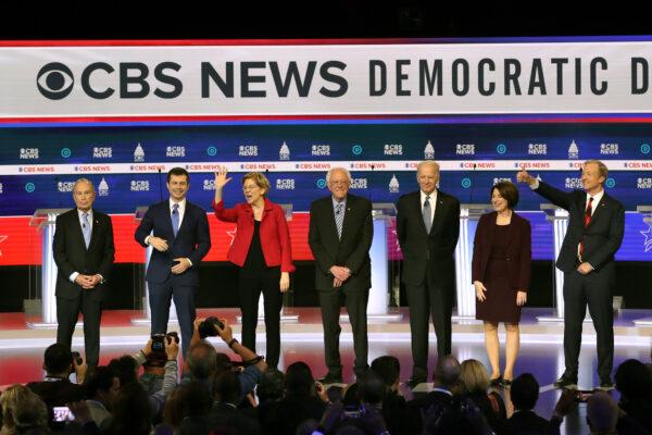 Democratic presidential candidates (L–R) former New York City Mayor Mike Bloomberg, former South Bend, Indiana, Mayor Pete Buttigieg, Sen. Elizabeth Warren (D-Mass.), Sen. Bernie Sanders (I-Vt.), former Vice President Joe Biden, Sen. Amy Klobuchar (D-Minn.), and Tom Steyer walk on stage prior to the Democratic presidential primary debate at the Charleston Gaillard Center in Charleston, S.C., on Feb. 25, 2020. (Win McNamee/Getty Images)