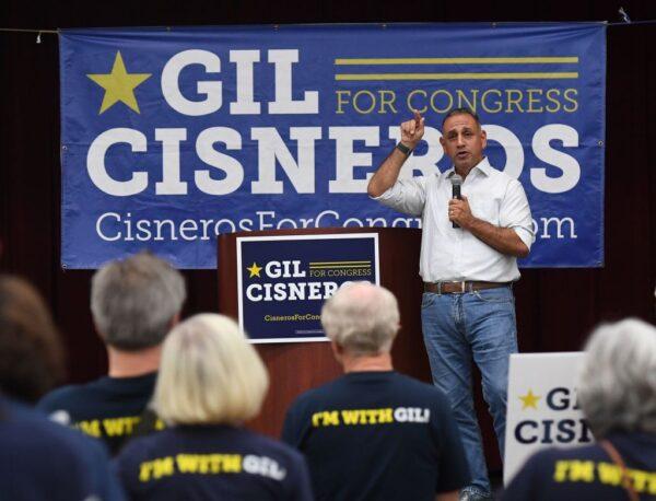 Democratic Party candidate Gil Cisneros campaigns for the United States House of Representatives to represent California's 39th congressional district during the 2018 midterm elections, in Buena Park, Calif., on Nov. 5, 2018. (Mark Ralston/AFP via Getty Images)