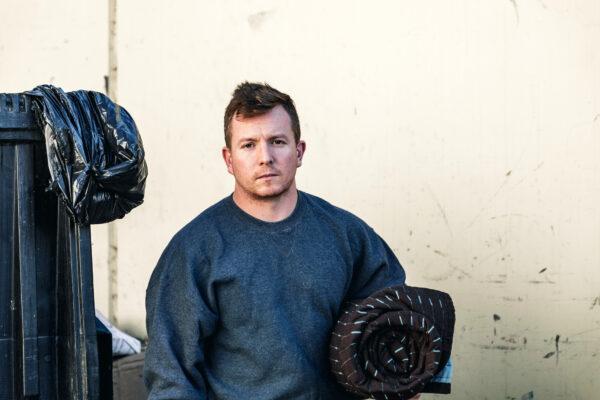 Formerly homeless veteran Samuel Johnson carries a bedroll in Tustin, Calif., on Nov 4, 2019. (Courtesy Orange County Rescue Mission)