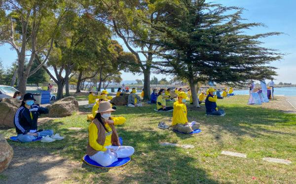Falun Dafa practitioners meditate at Marina Park in San Leandro, Calif., on July 18, 2020. (Ilene Eng/The Epoch Times)