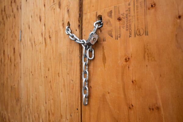 A business space is boarded and locked in El Segundo, Calif., on June 25, 2020. (John Fredricks/The Epoch Times)