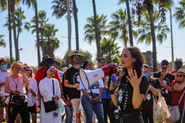 Gia Chacon speaks to a crowd gathered by her organization, For the Martyrs, to raise awareness about persecuted Christians worldwide, in Long Beach, Calif., on Sept. 5, 2020. (Jamie Joseph/The Epoch Times)