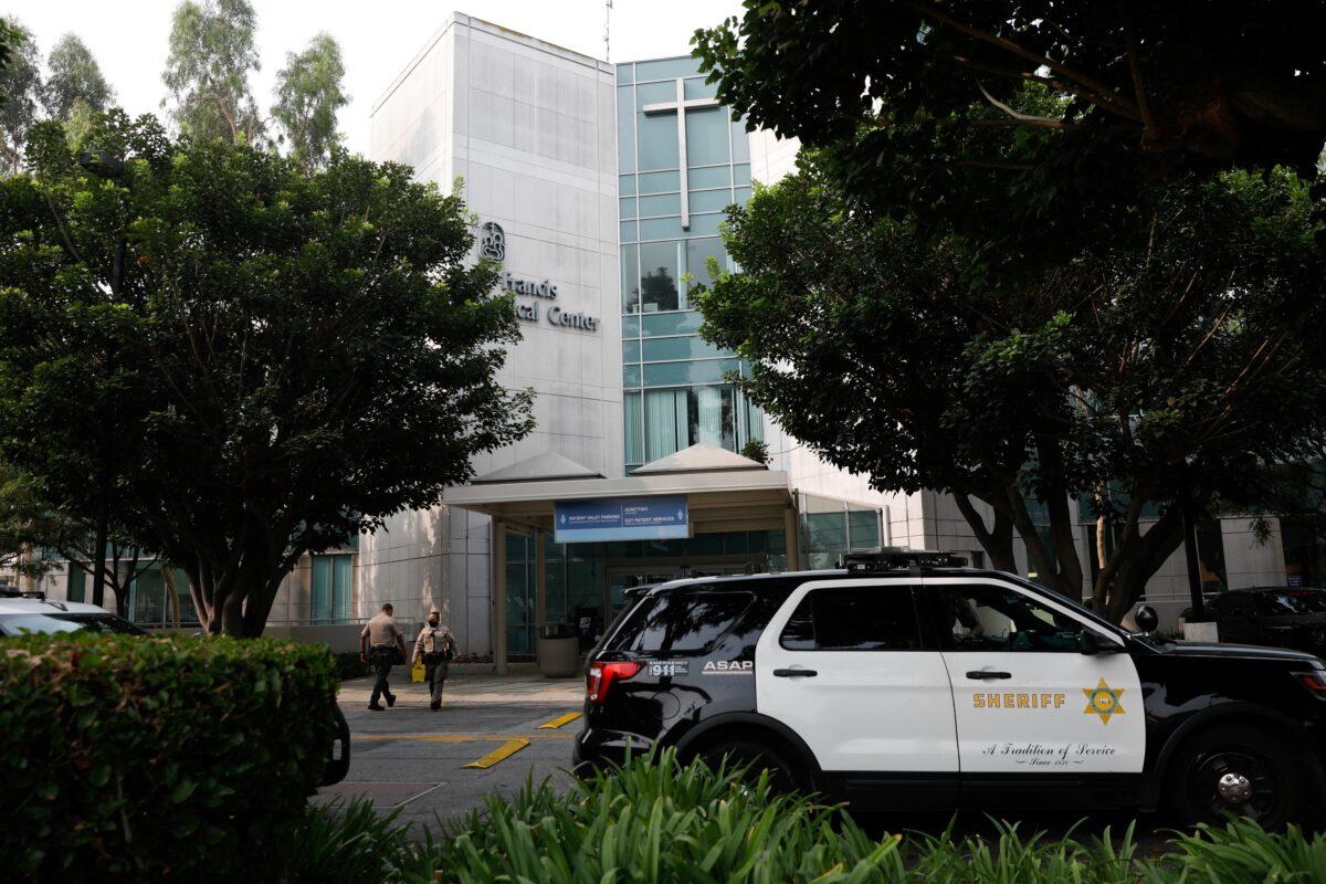 Los Angeles County Sheriff's Department deputies walk outside St. Francis Medical Center hospital following the ambush shooting of two deputies in Compton, in Lynwood, Calif., on Sept. 13, 2020. (Patrick T. Fallon/Reuters)