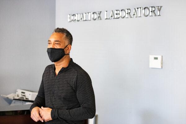 Alex Mohamed, vice president of sales and marketing for EqualTox, stands in the EqualTox reception area in Tustin, Calif., on Sept. 3, 2020. (John Fredricks/The Epoch Times)