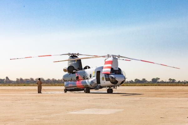 A new Chinook firefighting helicopter with a 3,000-gallon water capacity waits on the runway in Los Alamitos, Calif., on Sept. 30, 2020. (John Fredricks/The Epoch Times)