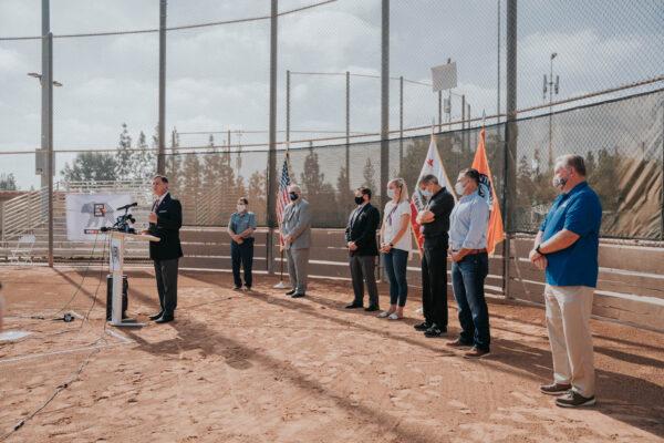 Supervisor Donald Wagner is joined by Olympic gold medalists, youth sports league representatives, and Orange County officials at a gathering to call for the immediate reopening of youth sports throughout the county at Tustin Sports Park in Tustin, Calif., on Oct. 19, 2020. (Courtesy of the Office of Supervisor Don Wagner)